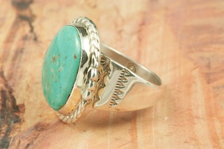 Genuine Crow Springs Turquoise set in Sterling Silver Ring. The Crow Springs Mine is located near Tonopah, Nevada. Created by Navajo Artist Tony Garcia. Signed.